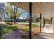 Covered porch with brick walkway, offering a view of the yard at 2718 Pine Grove Ct, Austell, GA 30106