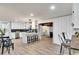 Open concept kitchen with island and breakfast bar, view of living room at 2718 Pine Grove Ct, Austell, GA 30106