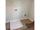 New laundry room with built-in washer and dryer space at 2723 Byess Ct, Marietta, GA 30064