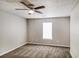 Bright bedroom featuring a ceiling fan and carpet at 9343 Haley Ct, Jonesboro, GA 30238