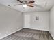 Spacious bedroom with ceiling fan and gray carpeting at 9343 Haley Ct, Jonesboro, GA 30238