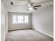 Bright bedroom with bay window and gray carpeting at 9343 Haley Ct, Jonesboro, GA 30238