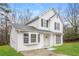 Two-story white house with gray shutters, landscaping, and a driveway at 9343 Haley Ct, Jonesboro, GA 30238