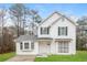 Two-story white house with gray shutters, landscaping, and a driveway at 9343 Haley Ct, Jonesboro, GA 30238