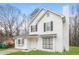 Two-story white house with gray shutters, landscaping, and a driveway at 9343 Haley Ct, Jonesboro, GA 30238