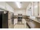 Kitchen with stainless steel appliances and granite countertops at 9343 Haley Ct, Jonesboro, GA 30238