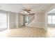 Living room with tile floors, ceiling fan, and staircase at 9343 Haley Ct, Jonesboro, GA 30238