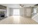 Living room with fireplace, tile floors, and staircase at 9343 Haley Ct, Jonesboro, GA 30238