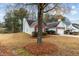 Side view of house with mature tree at 2457 Swan Lake Dr, Grayson, GA 30017