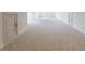 Large bonus room with neutral carpeting and ample natural light at 1106 Flowers Dr, Cumming, GA 30041