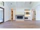 Modern living room with a stunning fireplace and built-in shelving at 1106 Flowers Dr, Cumming, GA 30041