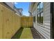 Narrow side yard with wood fence and small grass area at 88 Cleveland Se St # B, Atlanta, GA 30316