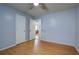 Spacious bedroom with light walls, wood flooring, and ceiling fan at 15 Magnolia Ne Ct, Rydal, GA 30171