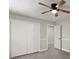 Bright bedroom with double closet and ceiling fan at 1886 S Hidden Hills Pkwy, Stone Mountain, GA 30088