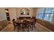 Formal dining room with an oval table and large mirror at 2613 Hewatt Rd, Snellville, GA 30039