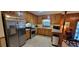 Kitchen with stainless steel appliances and wood cabinets at 2613 Hewatt Rd, Snellville, GA 30039