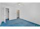 Bright bedroom with blue carpet and ample closet space at 3362 Eastmont Ln, Lithonia, GA 30038