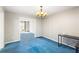 Bright dining room with chandelier and view of living room at 3362 Eastmont Ln, Lithonia, GA 30038