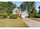 Two-story house with gray siding, brick accents, and a two-car garage at 3362 Eastmont Ln, Lithonia, GA 30038