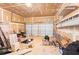 Unfinished garage with storage and various items at 3362 Eastmont Ln, Lithonia, GA 30038
