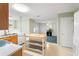 Kitchen features light wood cabinets and a kitchen island at 3362 Eastmont Ln, Lithonia, GA 30038