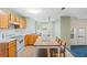 Cozy kitchen featuring wood cabinets and a breakfast bar at 3362 Eastmont Ln, Lithonia, GA 30038