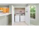 Stackable washer and dryer in a small laundry closet at 3362 Eastmont Ln, Lithonia, GA 30038