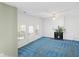 Living room with blue carpet, fireplace, and access to a patio at 3362 Eastmont Ln, Lithonia, GA 30038