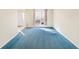 Spacious living room with blue carpet and access to front entrance at 3362 Eastmont Ln, Lithonia, GA 30038