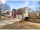 Two-story house with attached garage and manicured lawn at 487 Skiles Ct, Suwanee, GA 30024