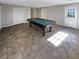 Finished basement game room, featuring a pool table and tile floors at 487 Skiles Ct, Suwanee, GA 30024