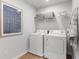 Convenient laundry room with washer and dryer at 5559 Rosehall Pl, Atlanta, GA 30349