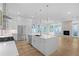 Modern kitchen with white shaker cabinets, large island, and stainless steel appliances at 90 Cleveland Se St # B, Atlanta, GA 30316