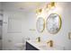 Bathroom featuring dual vanity, gold accents, and marble tile at 2085 High Point Sw Trl, Atlanta, GA 30331