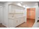 Modern white kitchen with gold hardware and quartz countertops at 2085 High Point Sw Trl, Atlanta, GA 30331