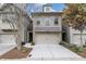 Brick front exterior of charming townhome with 2-car garage at 2251 W Village Ln, Smyrna, GA 30080