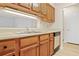 Wood cabinets and double sink in kitchen at 300 Johnson Ferry Ne Rd # B413, Atlanta, GA 30328