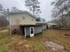 Large backyard with a shed and surrounding trees at 3550 Leisure Ln, Atlanta, GA 30349