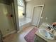 Bathroom with shower, garden tub, and double vanity at 690 Maggie Mae Ln, Lawrenceville, GA 30045