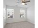 Bright bedroom with two windows and ceiling fan at 902 Edwin Ln, Sugar Hill, GA 30518