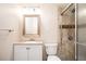 Bathroom with beige tile shower and single vanity at 2049 Nancy Se Cir, Smyrna, GA 30080