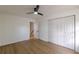 Bedroom with hardwood floors, double doors leading to the closet and access to hallway at 3607 Paddock Dr, Decatur, GA 30034