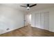 Bedroom with hardwood floors, double door closet and ceiling fan at 3607 Paddock Dr, Decatur, GA 30034