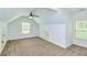 Bright bedroom with two windows, ceiling fan, and carpet at 45 Knight Ln, Mcdonough, GA 30252
