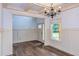 Formal dining room boasting hardwood floors and wainscoting at 45 Knight Ln, Mcdonough, GA 30252