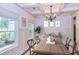 Formal dining room featuring hardwood floors, a chandelier, and wainscoting at 45 Knight Ln, Mcdonough, GA 30252