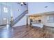 Open living space with hardwood floors, kitchen, and staircase at 45 Knight Ln, Mcdonough, GA 30252