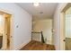 Upstairs hallway with hardwood floors and access to bedrooms and bathroom at 45 Knight Ln, Mcdonough, GA 30252