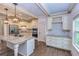 Modern kitchen with granite island, stainless steel appliances, and hardwood floors at 45 Knight Ln, Mcdonough, GA 30252