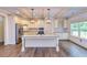 Spacious kitchen with granite island, stainless steel appliances, and hardwood floors at 45 Knight Ln, Mcdonough, GA 30252